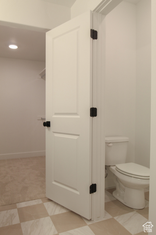Bathroom with toilet and recessed lighting