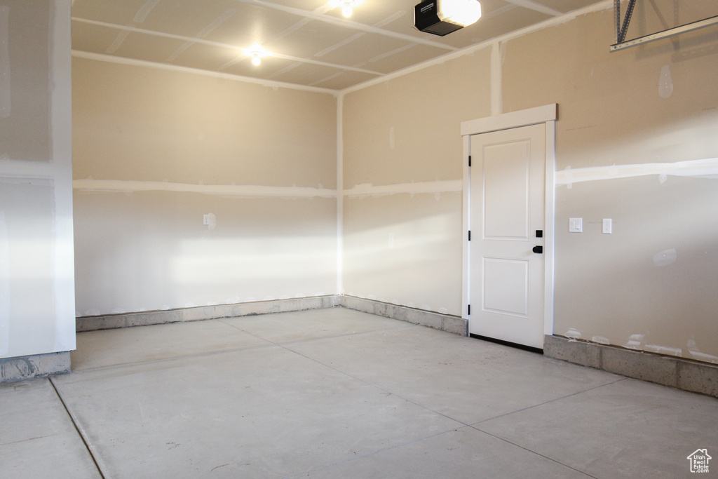Garage featuring a garage door opener