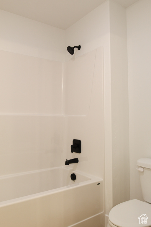 Bathroom with toilet and shower / bathtub combination