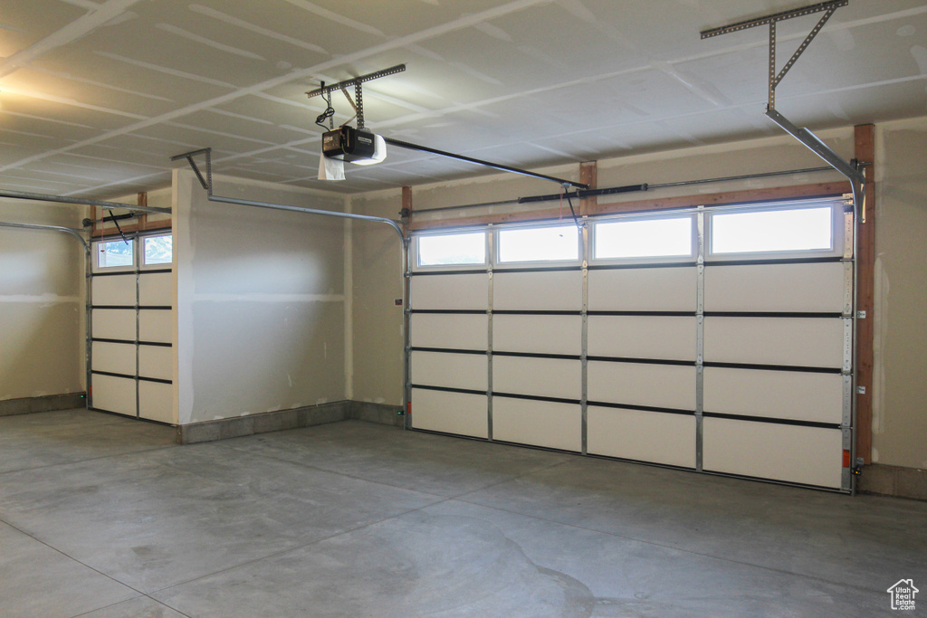 Garage featuring a garage door opener