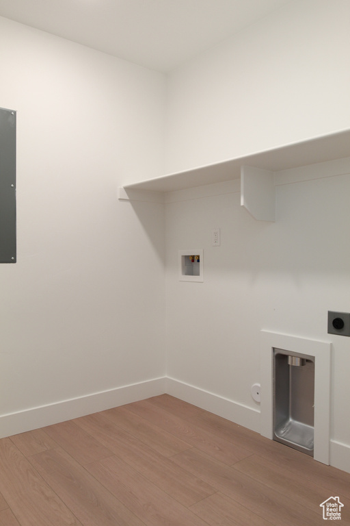 Laundry area featuring light wood-type flooring, washer hookup, hookup for an electric dryer, and gas dryer hookup