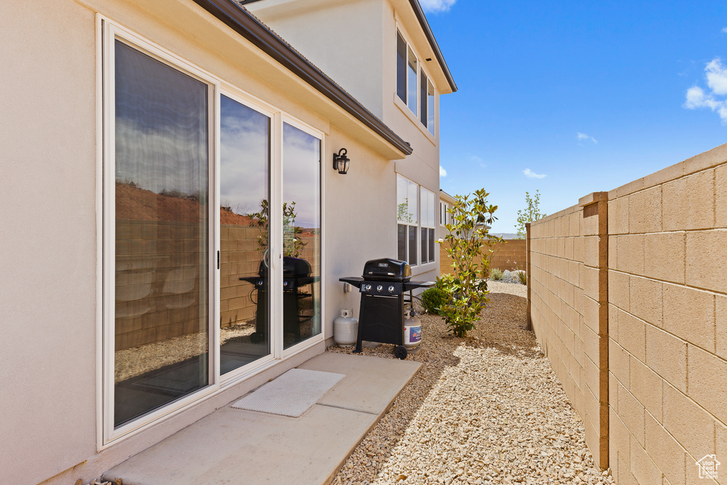 View of patio / terrace featuring a fenced backyard and a grill