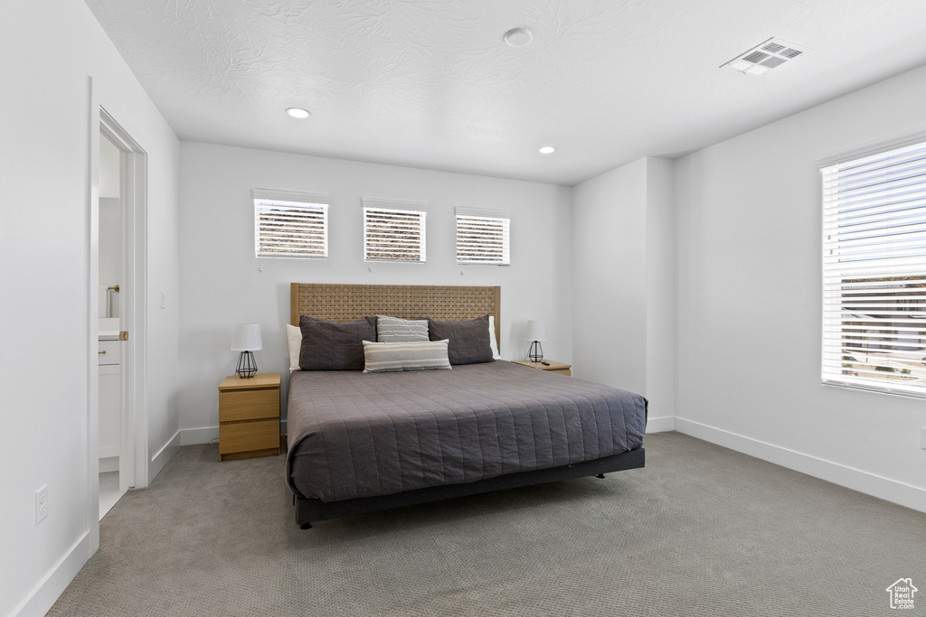 Bedroom with carpet, baseboards, and recessed lighting