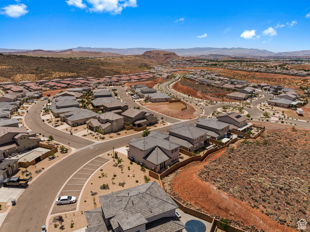 Aerial perspective of suburban area featuring a mountain backdrop