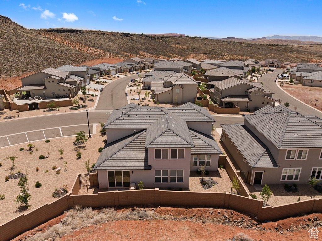 Aerial view of residential area with a mountainous background