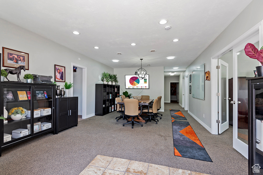 Dining room featuring carpet, recessed lighting, baseboards, and a chandelier