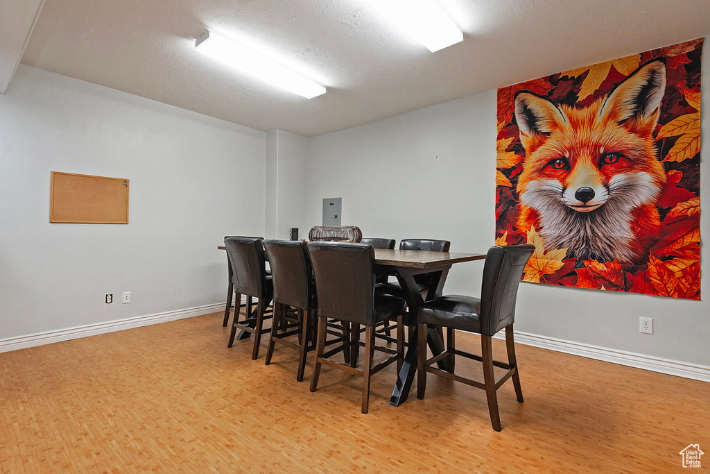 Dining room featuring wood finished floors and baseboards