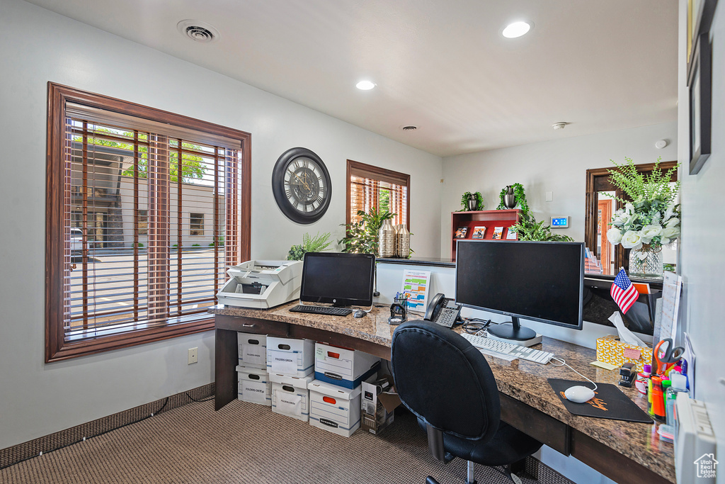 Carpeted office featuring healthy amount of natural light, recessed lighting, and built in study area