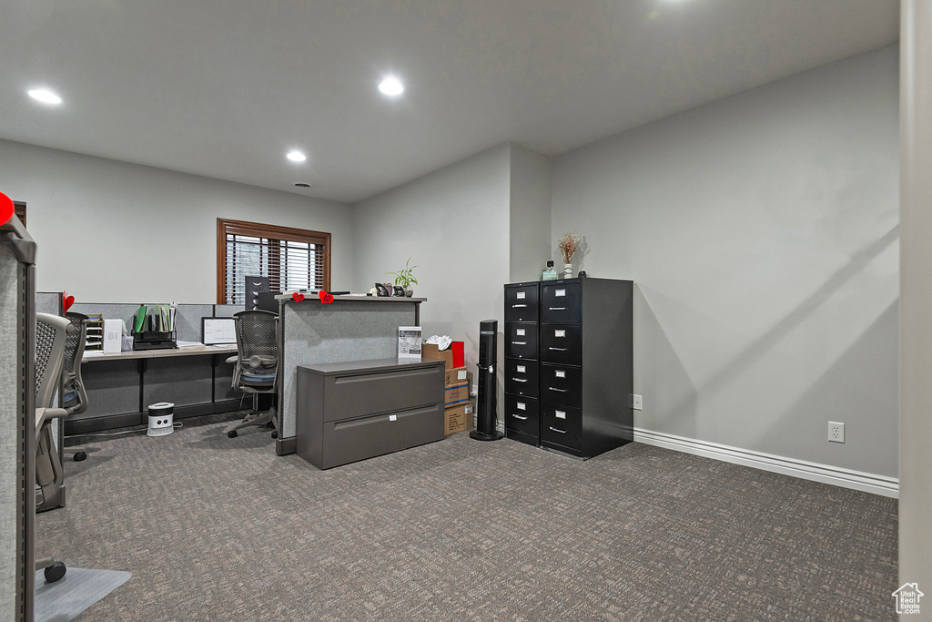 Carpeted office with recessed lighting and baseboards