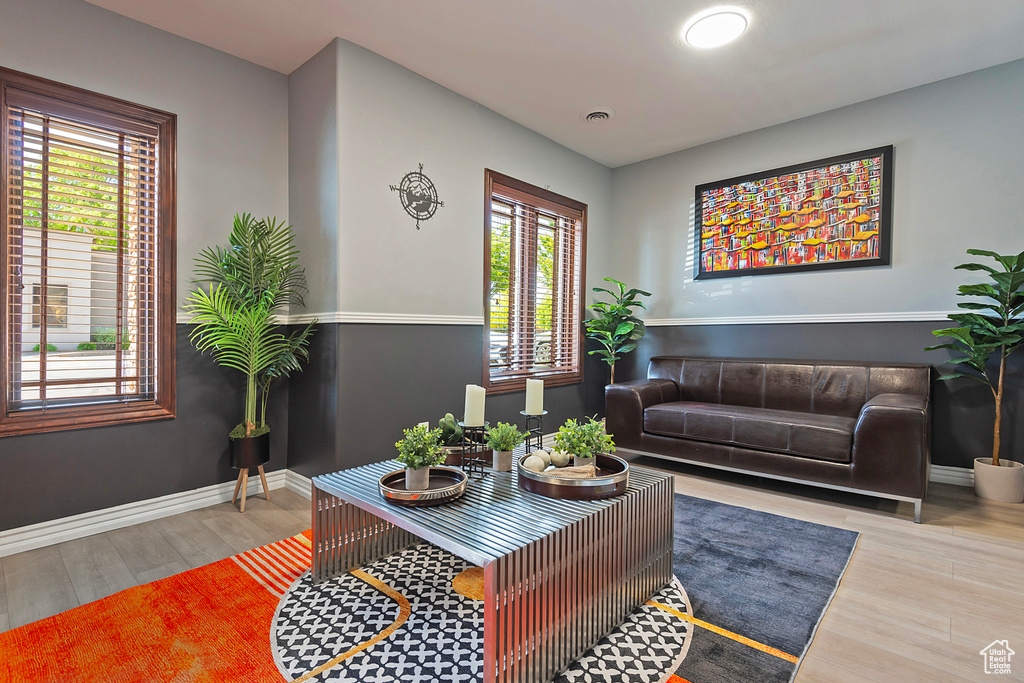 Living area featuring wood finished floors and baseboards
