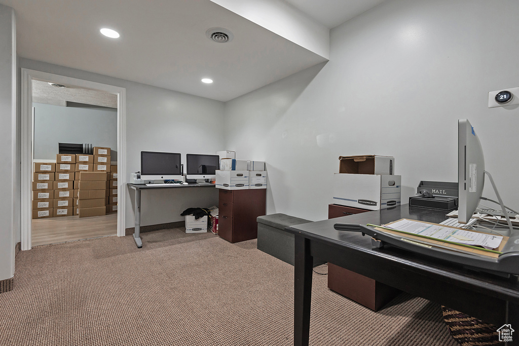 Office space featuring light carpet and recessed lighting