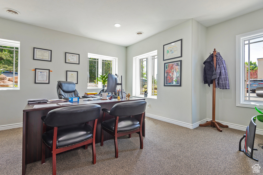Carpeted office with baseboards and recessed lighting