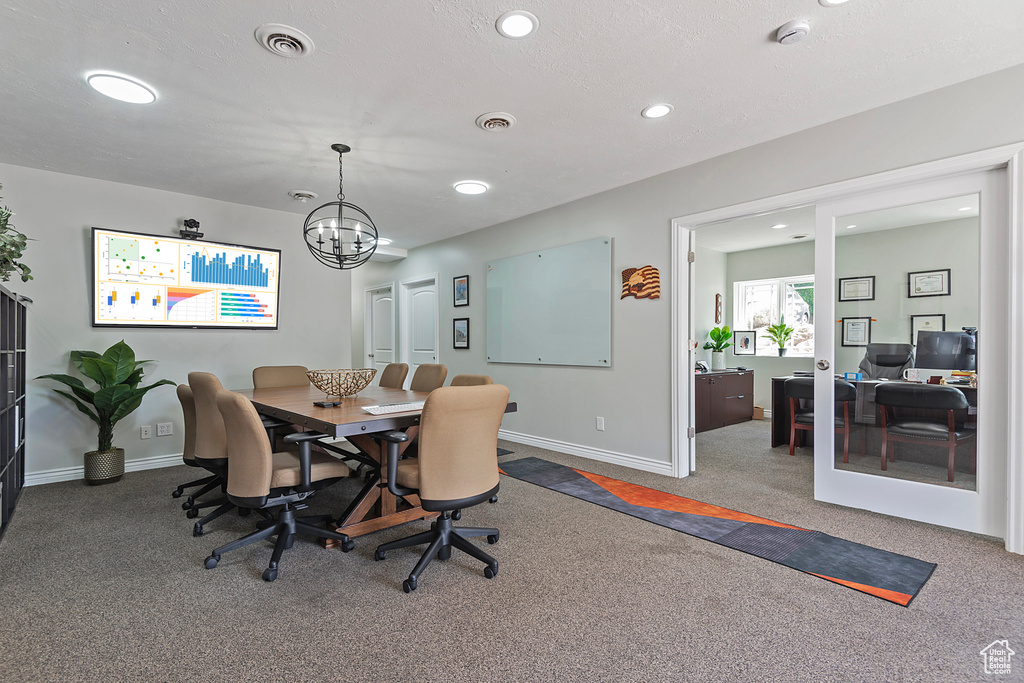 Dining space with carpet floors, an office area, a chandelier, recessed lighting, and baseboards