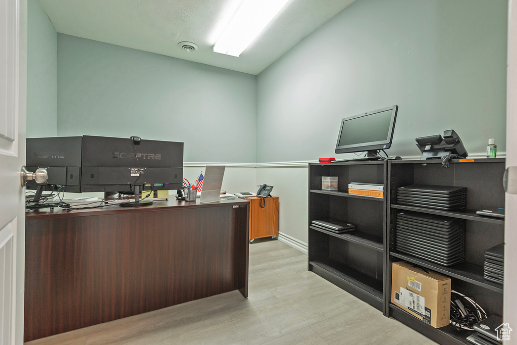 Office area with wood finished floors