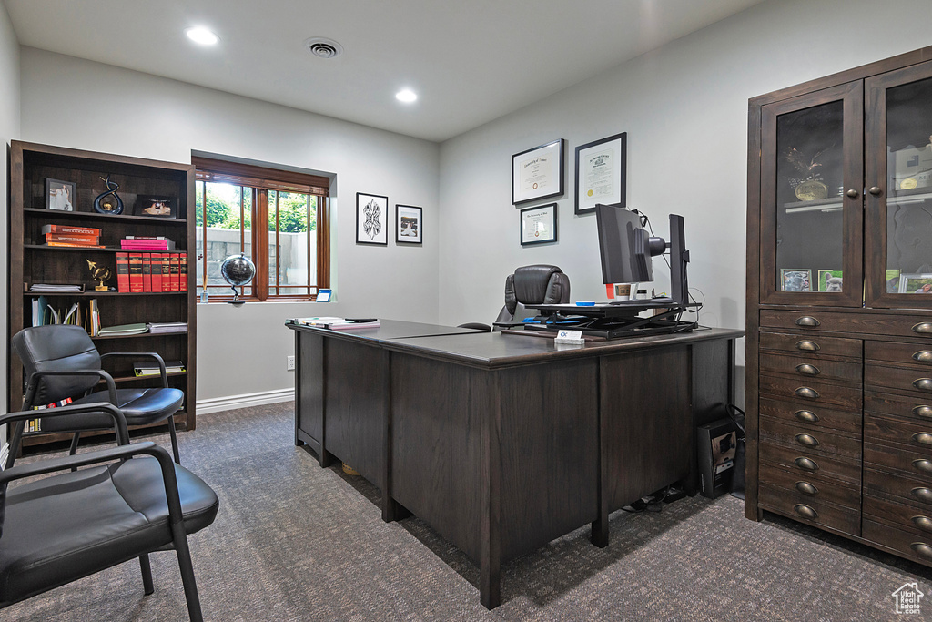 Office featuring dark carpet and recessed lighting