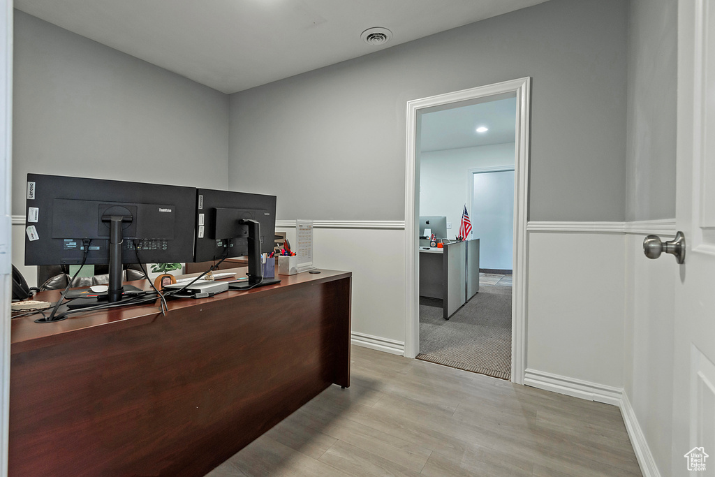 Office space with wood finished floors