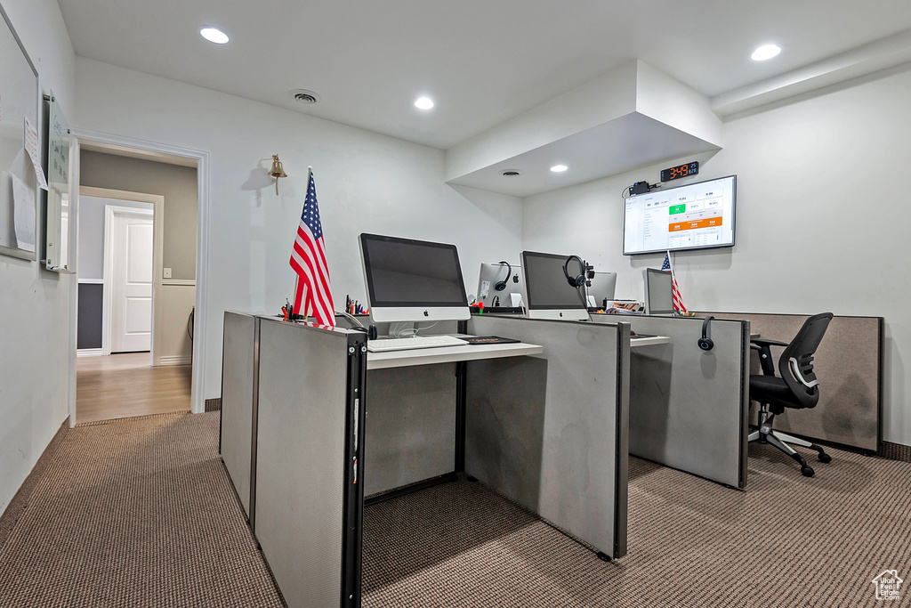 Carpeted office with recessed lighting