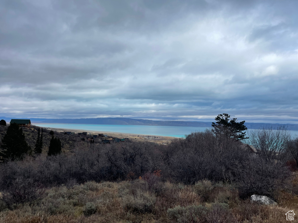 Mountain view featuring a nearby body of water