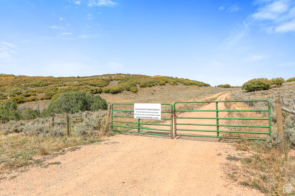 Gate featuring a rural view and fence