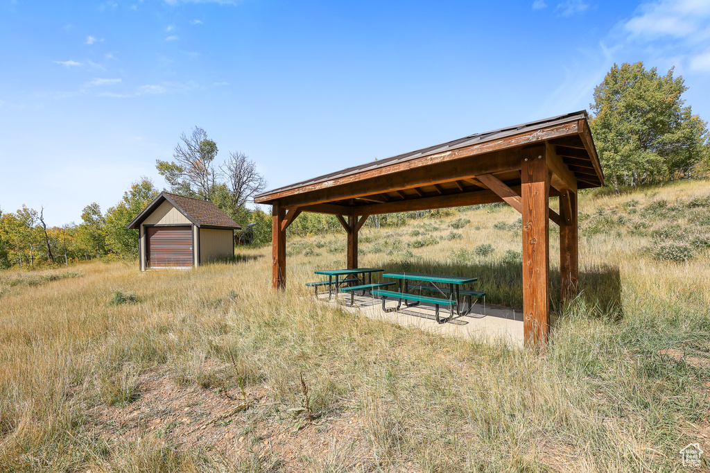 View of community featuring a gazebo and an outdoor structure