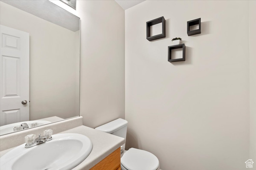 Half bath with toilet and vanity