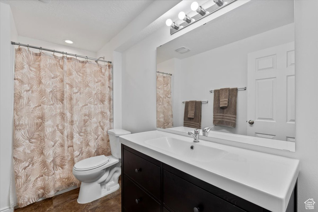 Bathroom with toilet and vanity
