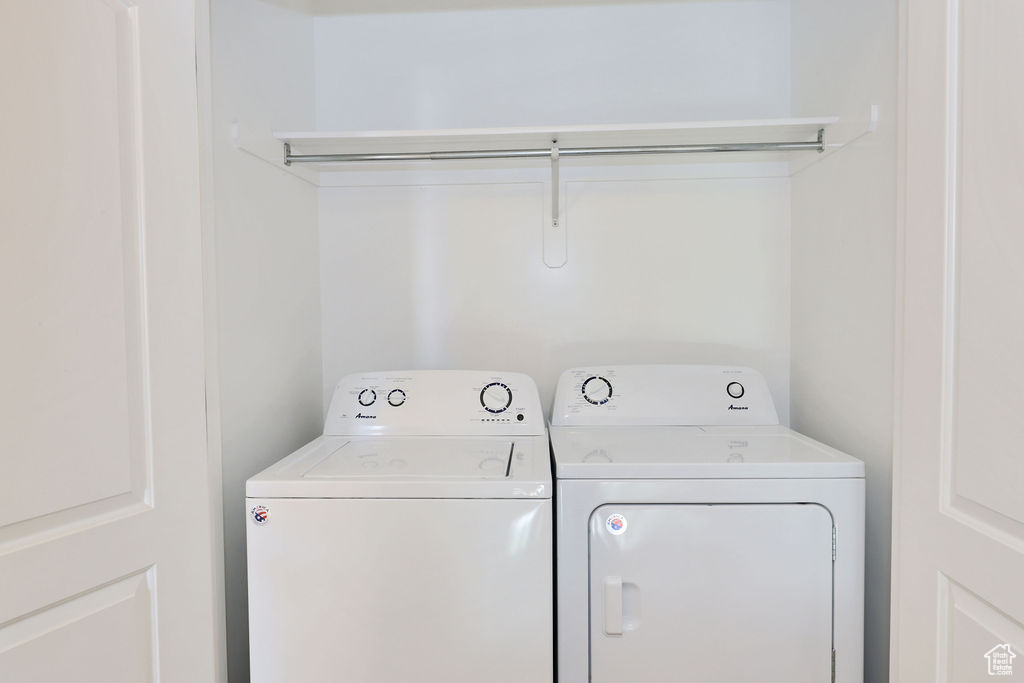 Washroom featuring independent washer and dryer