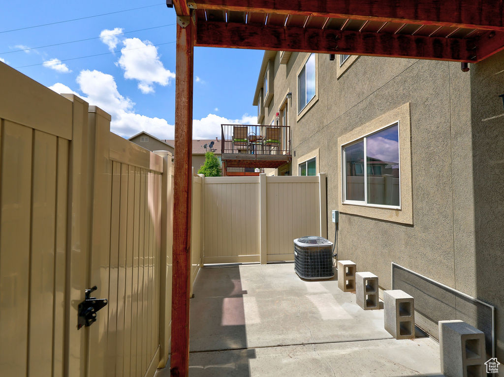 View of patio / terrace with fence and central AC unit