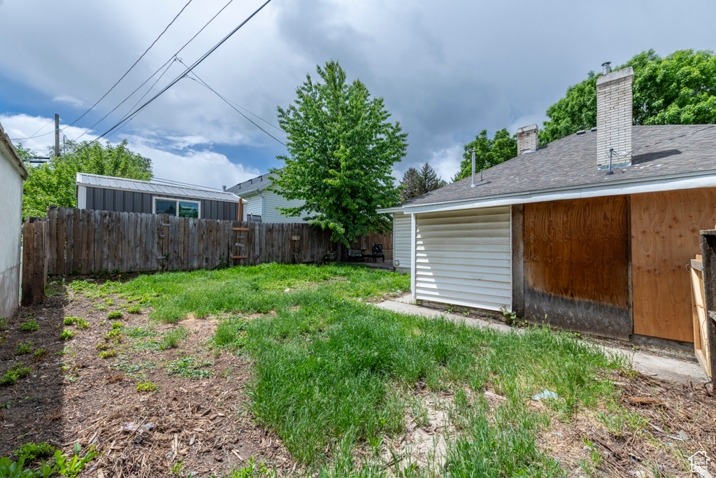 View of yard featuring fence