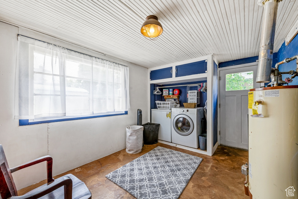 Washroom with washer and dryer and gas water heater