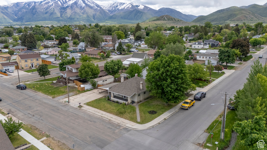 Aerial perspective of suburban area featuring a mountain backdrop