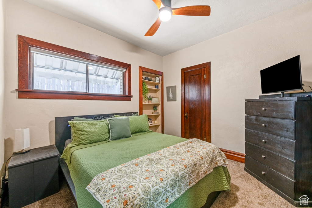 Bedroom with carpet, a closet, ceiling fan, and baseboards