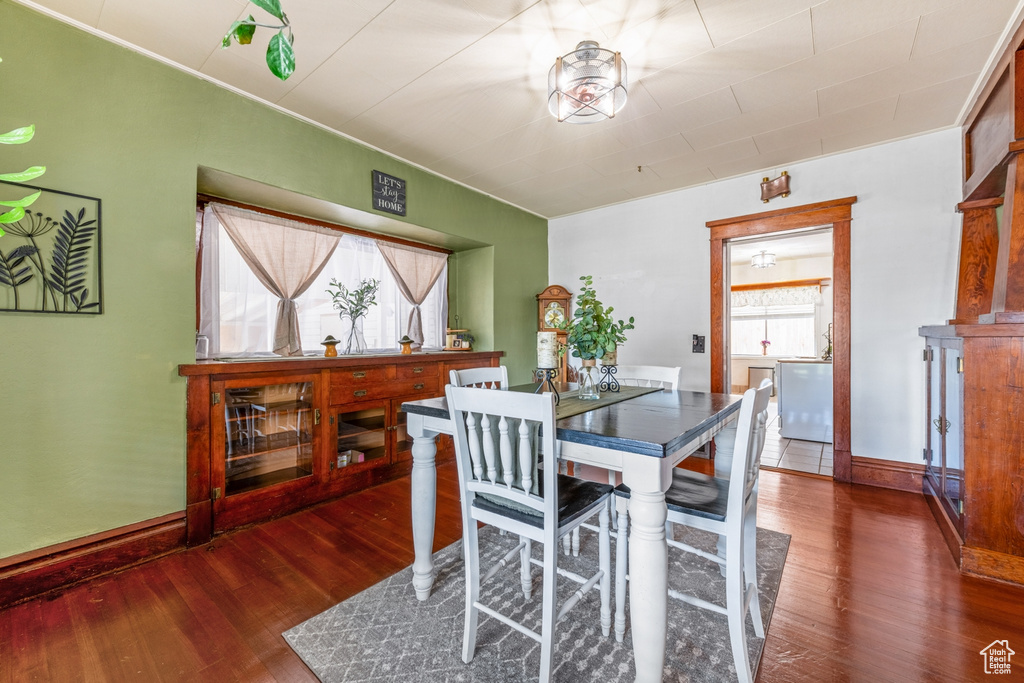 Dining room with wood finished floors and baseboards