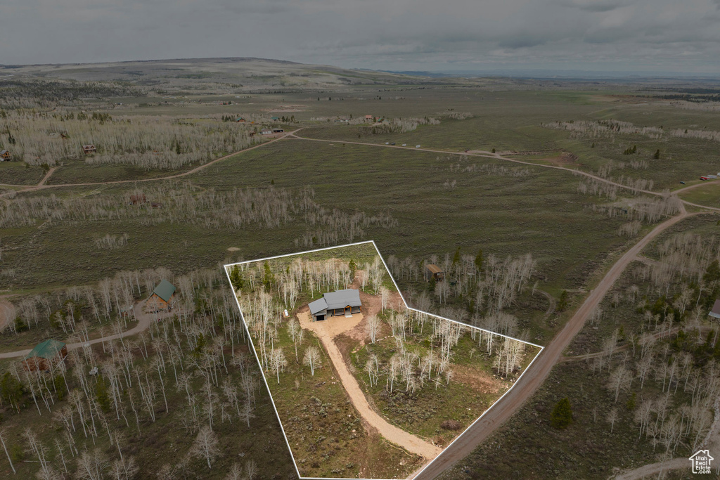 Aerial view of sparsely populated area with property boundaries highlighted