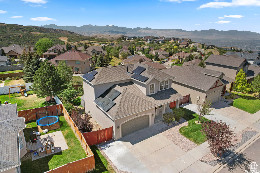 Aerial perspective of suburban area with a mountain backdrop