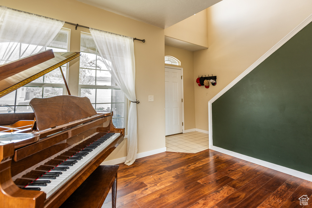 Entryway featuring wood-type flooring and baseboards