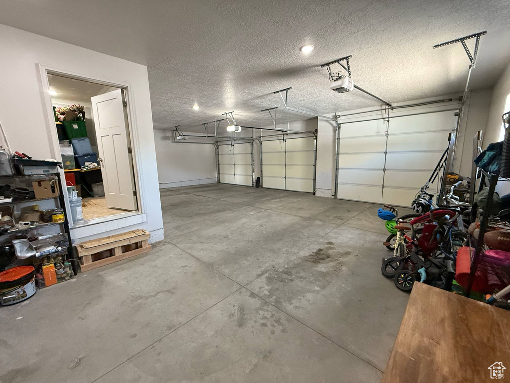 Garage featuring a garage door opener