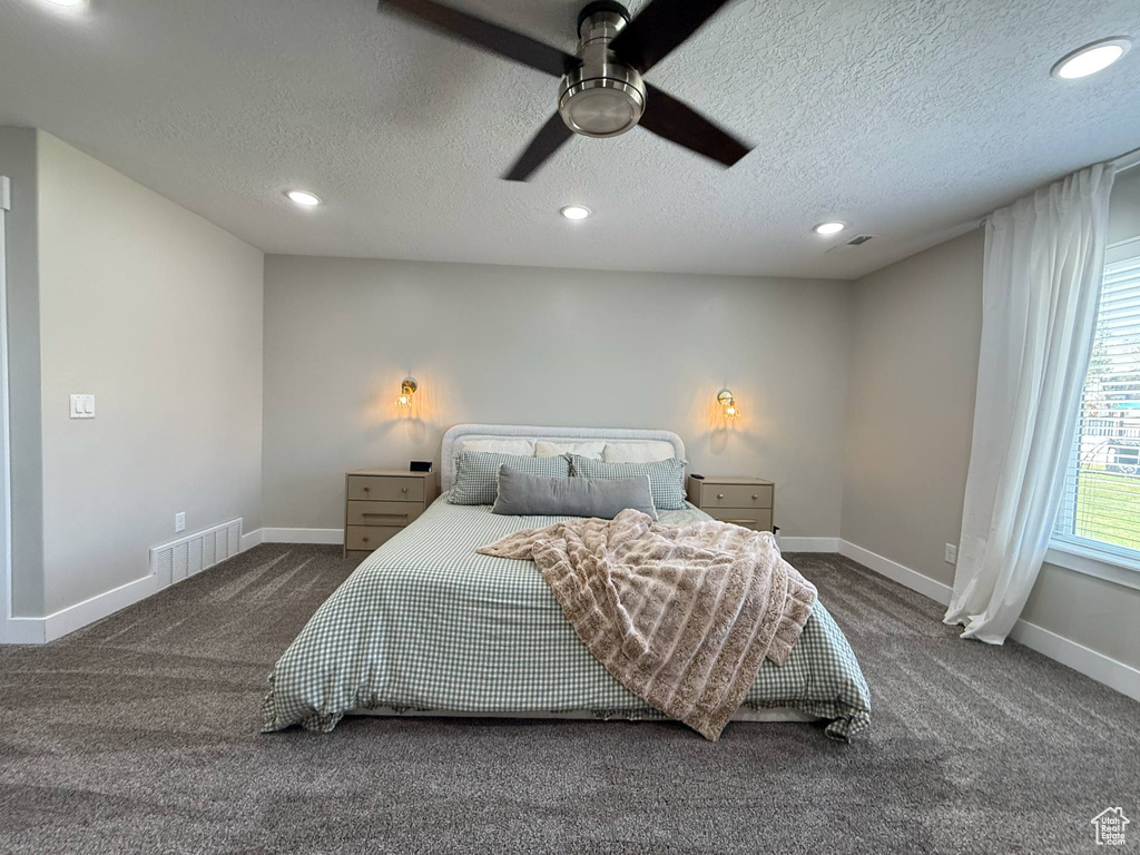 Bedroom with carpet flooring, recessed lighting, a textured ceiling, baseboards, and a ceiling fan