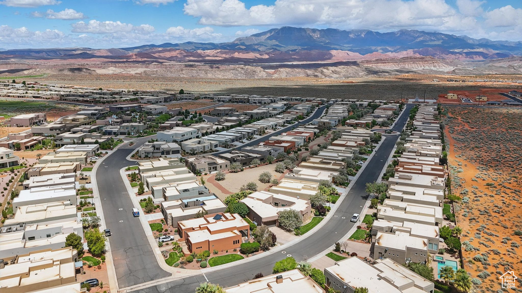 Aerial perspective of suburban area with a mountain backdrop