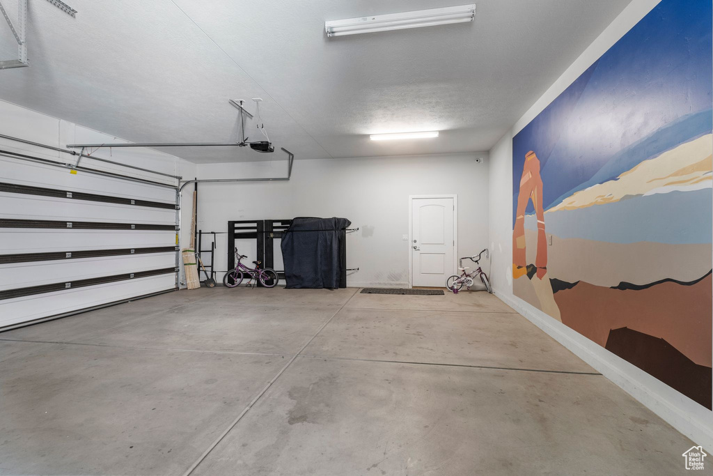 Garage featuring a garage door opener
