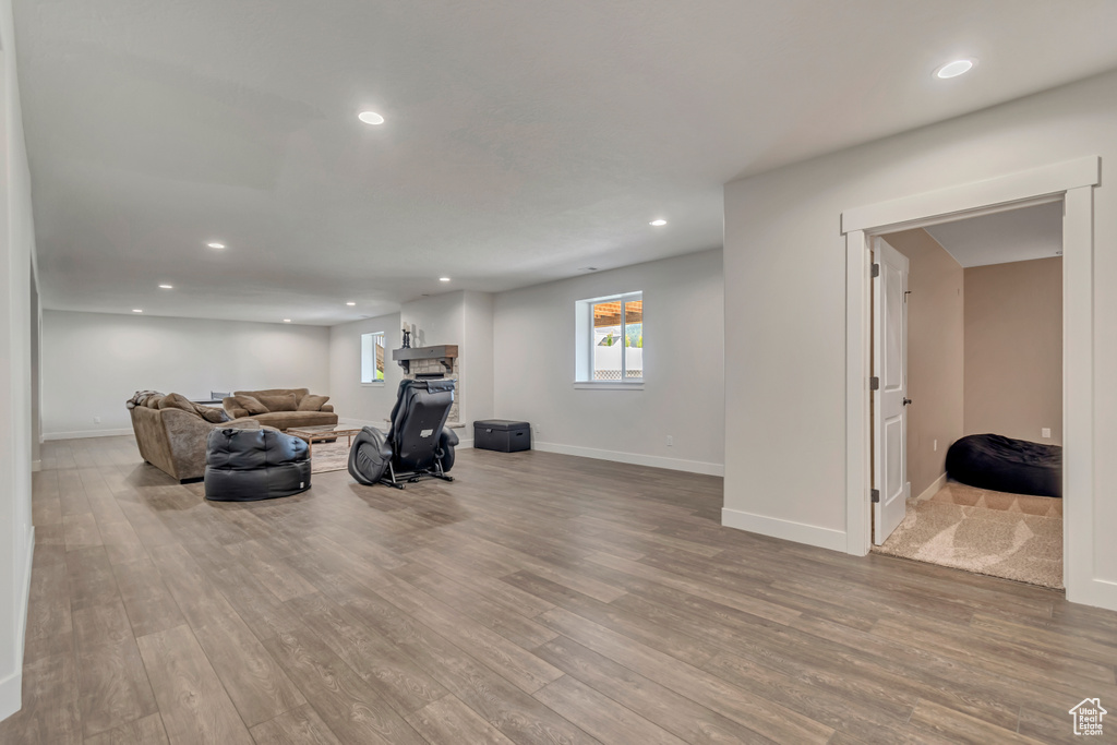Living area featuring wood finished floors, recessed lighting, and baseboards