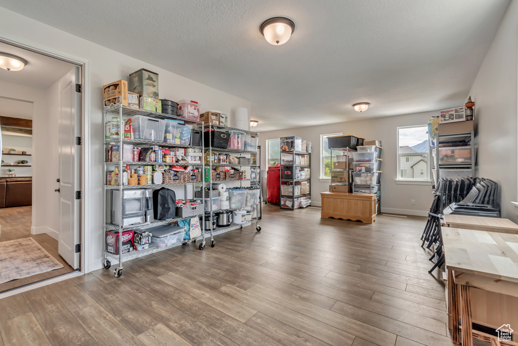 Home office featuring wood finished floors and baseboards