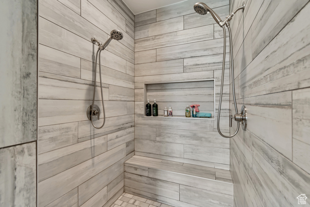 Bathroom featuring a tile shower and a relaxing sauna