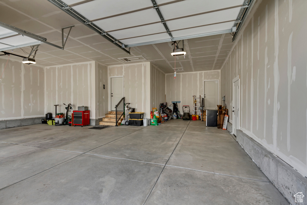 Garage featuring a garage door opener