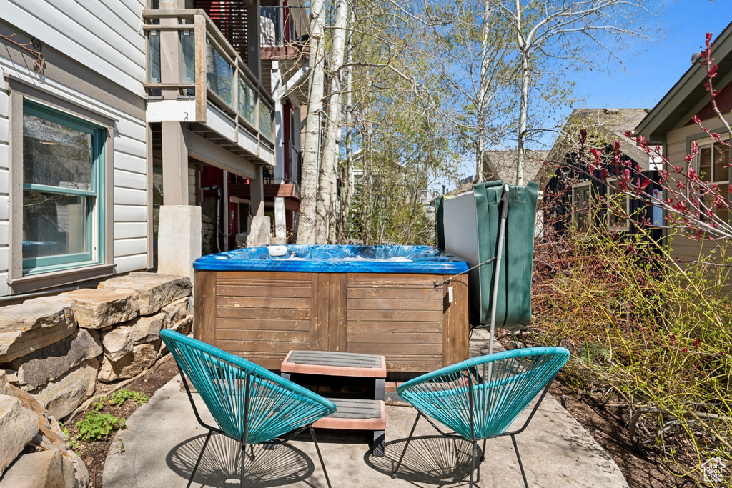 View of patio featuring a hot tub
