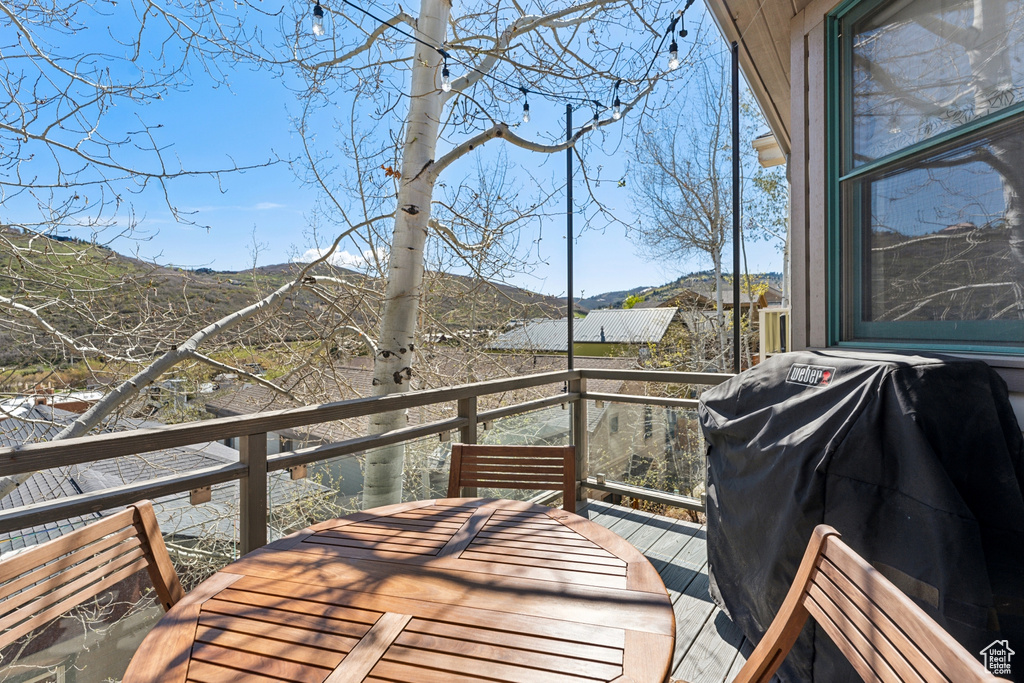 Deck featuring a mountain view and a grill