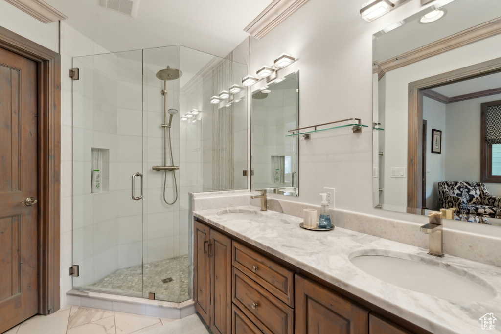 Full bathroom with a stall shower and double vanity