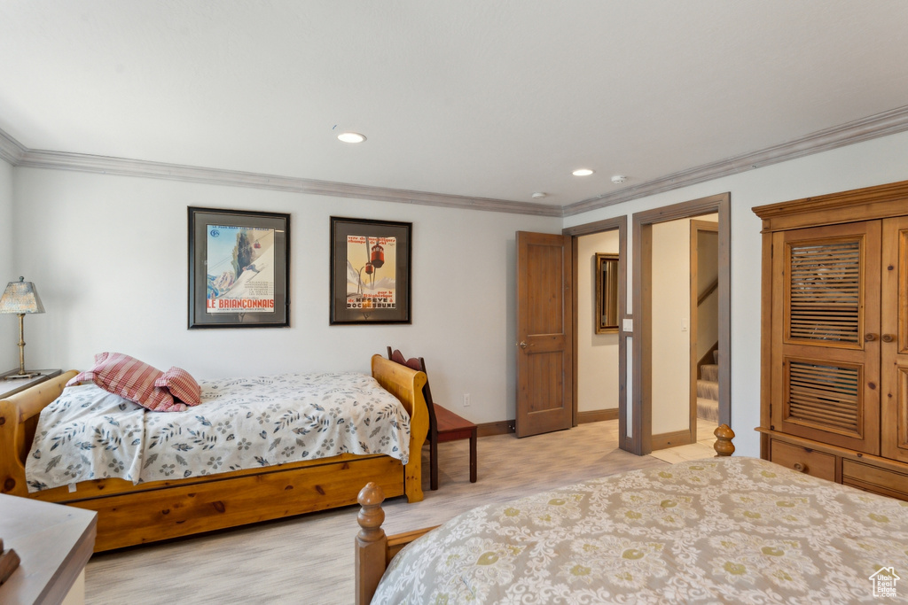 Bedroom with ornamental molding, baseboards, and recessed lighting
