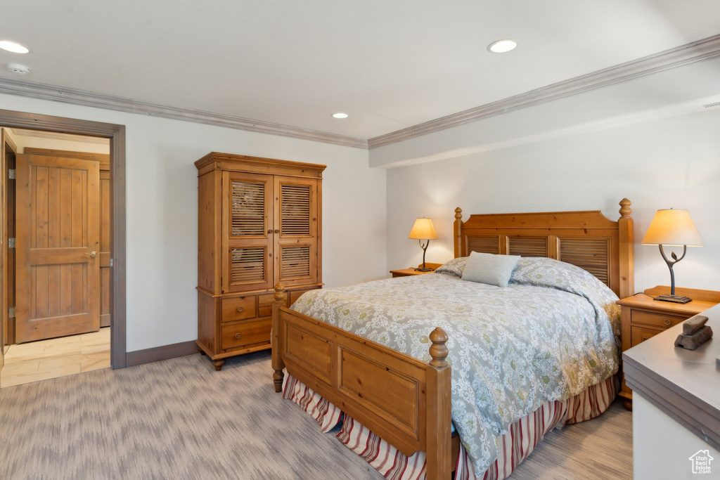 Bedroom featuring crown molding, recessed lighting, and baseboards
