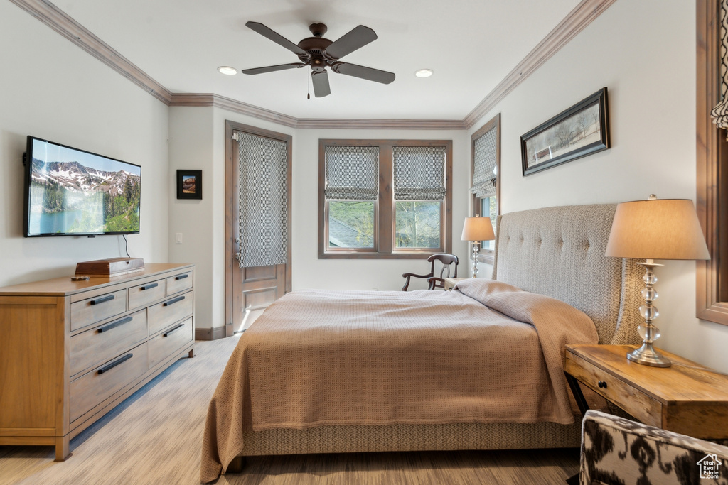 Bedroom featuring light wood-type flooring, crown molding, recessed lighting, access to outside, and baseboards